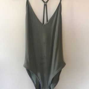 Green topshop bodysuit. Super cute!
